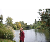 My wife standing next to the lake